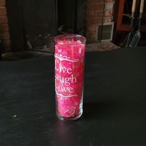 Decorative vase filled with pink gems